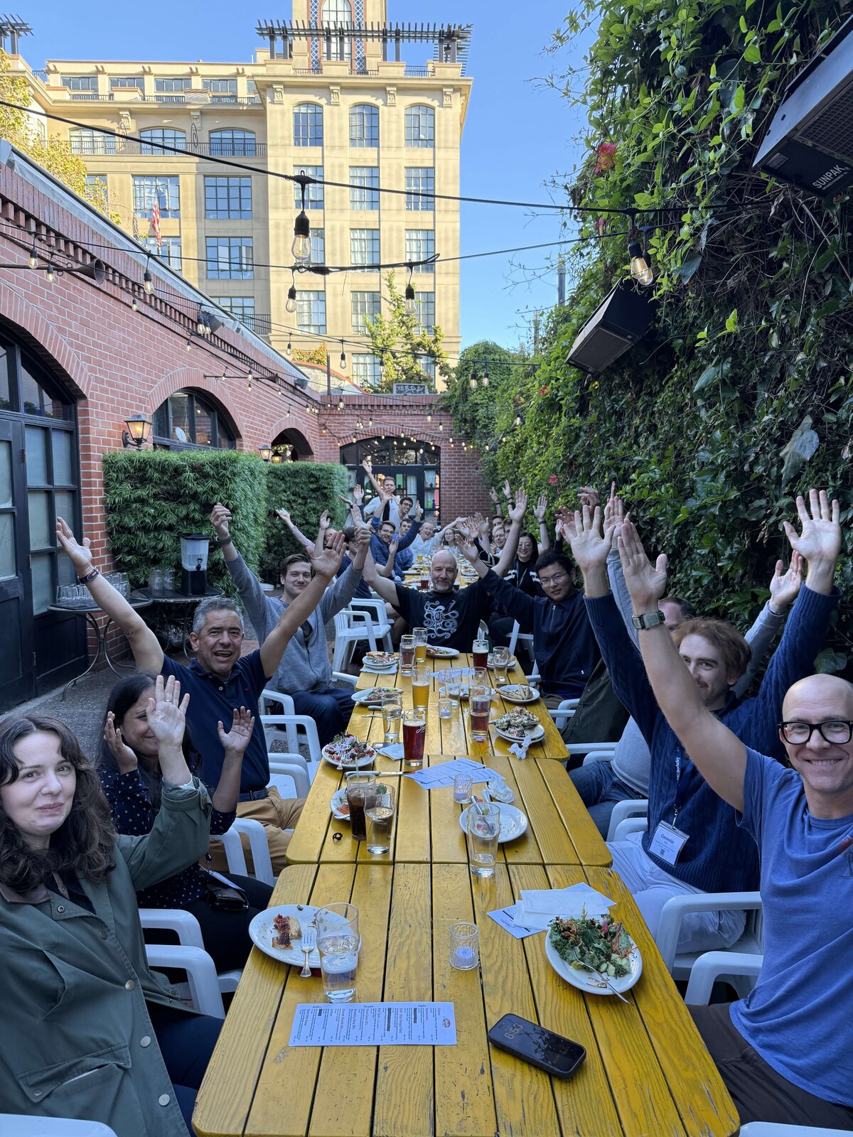 Participants at the first AAI4Science Developer Summit gathered around an outdoor dinner table in Berkeley